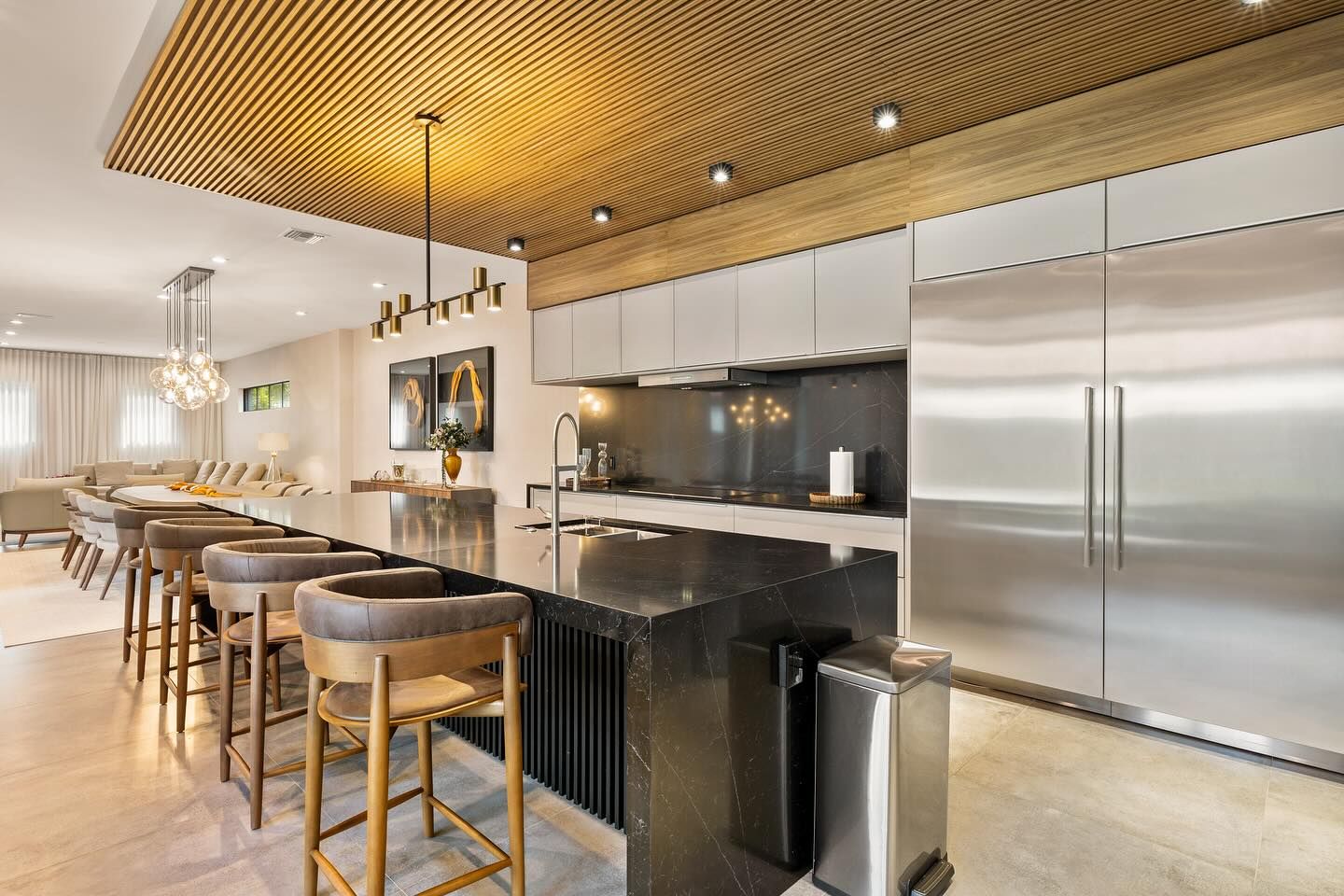 Kitchen with wood slat ceiling and long island